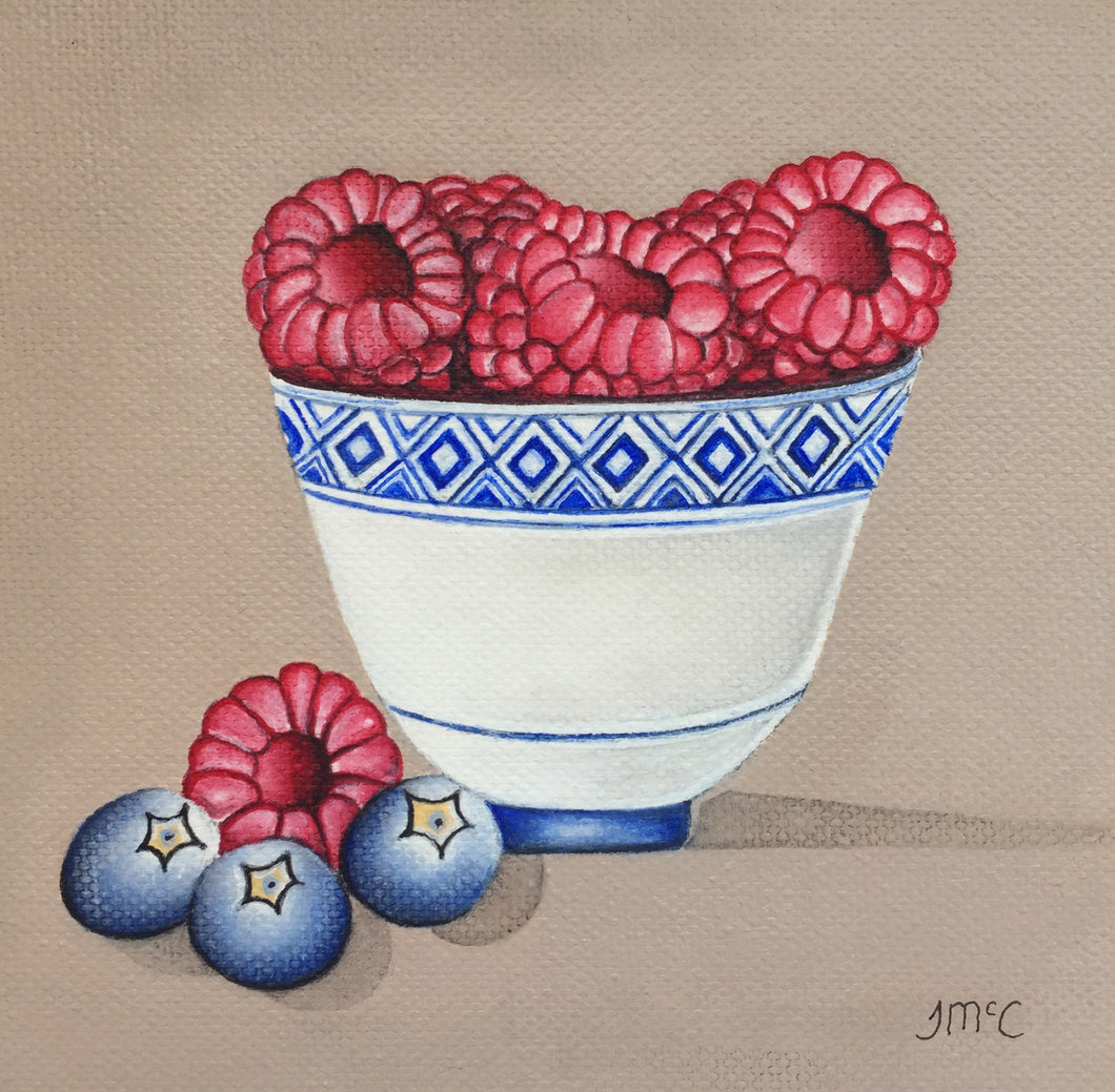 Little blue pot of raspberries